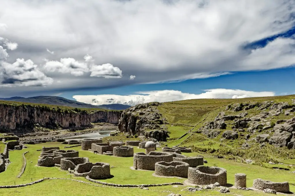 Explore the stunning ancient ruins in Espinar, Cusco, Peru, under a dramatic sky.